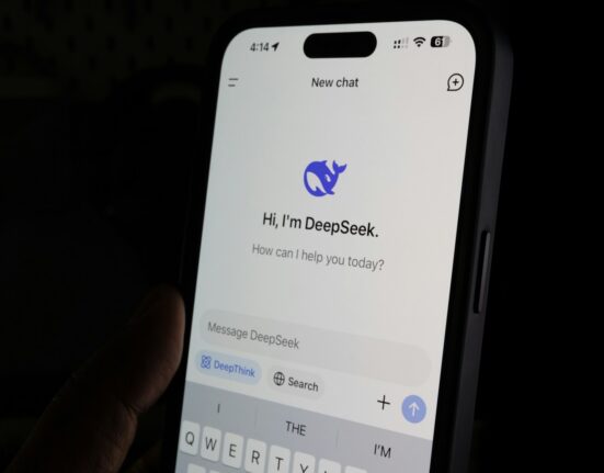 A person holding a cell phone in their hand