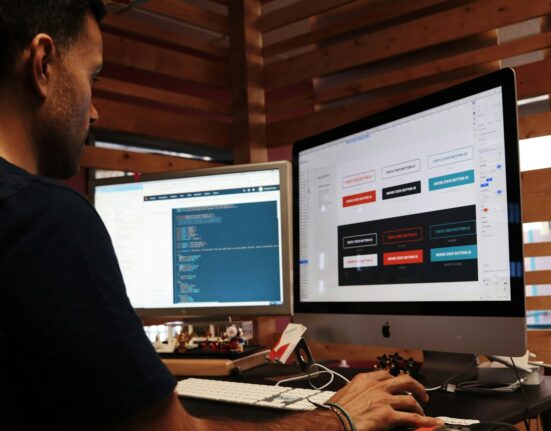 man using Apple computer